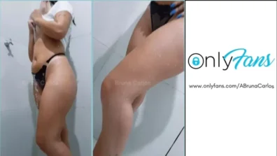 Bruna Carlos embaixo do chuveiro de blusa