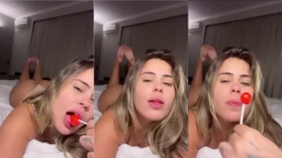 Piranha Ani Rocha deitada só de calcinha chupando um pirulito