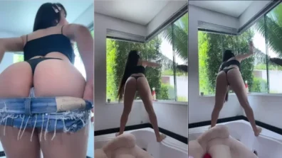Juliana Bonde limpando o banheiro usando uma calcinha fio dental