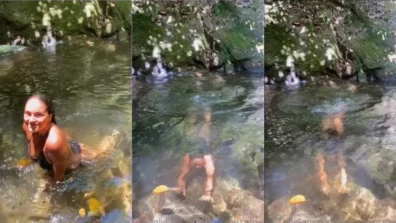 Linda Paola Buzzone nadando no lago