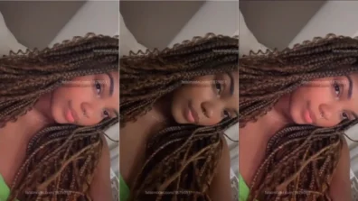 Mayra Santinni preta de cabelo rasta se filmando